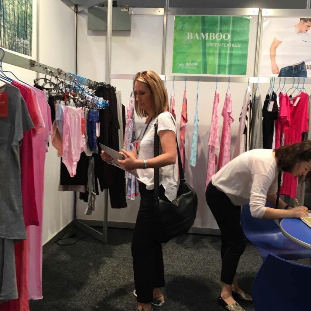 women in clothing stand